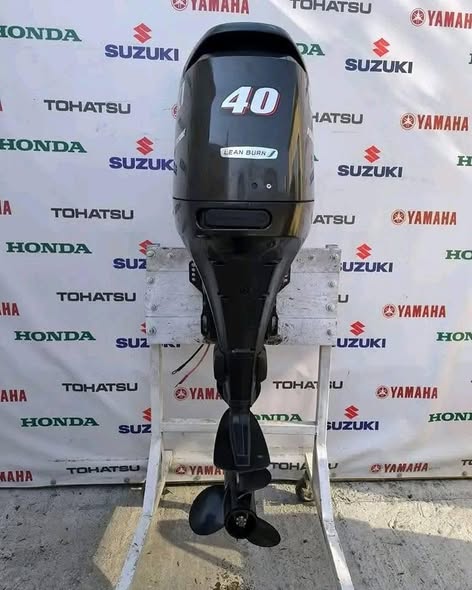 2014 Suzuki 40HP 4 Stroke EFI outboard motor mounted on fishing boat