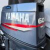 Yamaha 60HP 2 Stroke oil injected outboard mounted on fishing boat