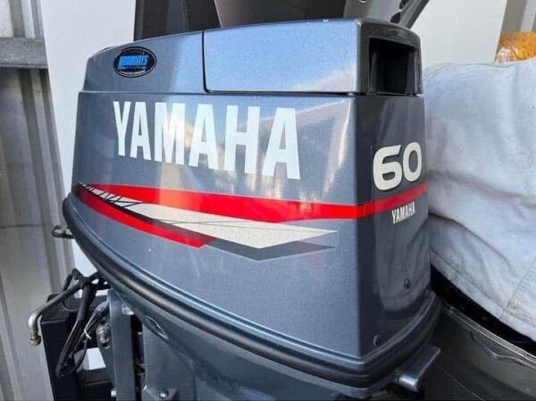 Yamaha 60HP 2 Stroke oil injected outboard mounted on fishing boat