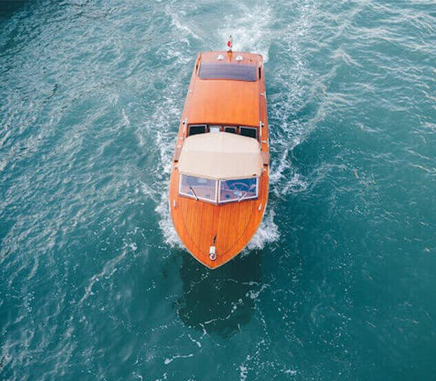 Boat traveling on open water during coastal journey