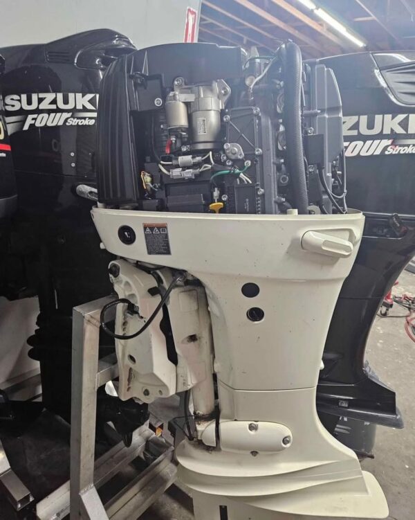 Clean Suzuki 140HP outboard ready for offshore boating use