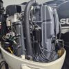 Suzuki four-stroke marine engine with controls and gauges included
