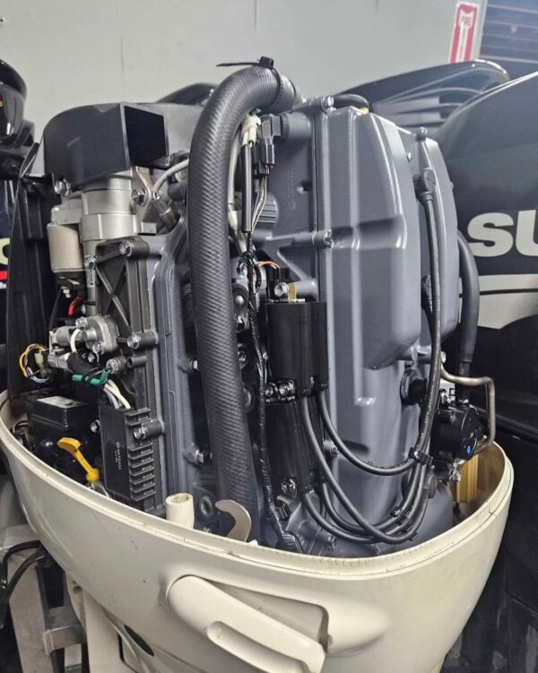 Suzuki four-stroke marine engine with controls and gauges included
