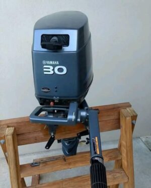 Yamaha 30HP 2 Stroke outboard motor mounted on small fishing boat