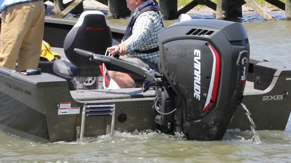 115 HP Evinrude outboard for sale mounted on fishing boat