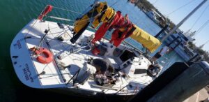 Marine technician servicing boat outboard engine in Australia workshop